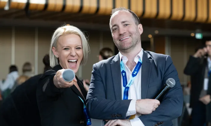 Hosts laughing at Digital Adelaide 2025